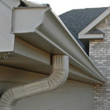 Tan colored gutter and downspout